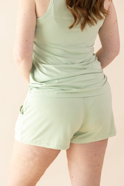 Female modeling the back of the Women's Tank Set in Basil
