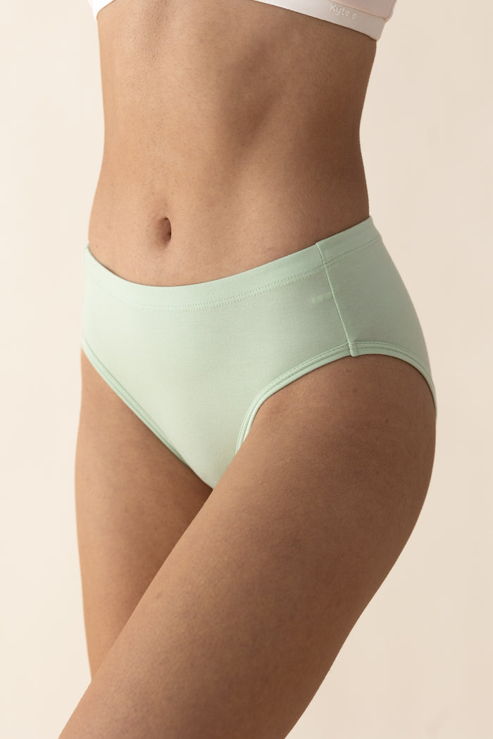 Woman wearing a light green pair of underwear