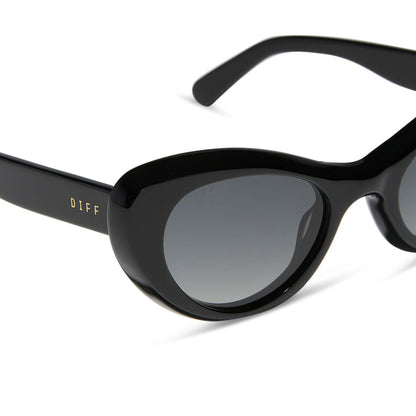diff eyewear featuring the zaria cat eye sunglasses with a black frame and grey gradient polarized lenses detailed view